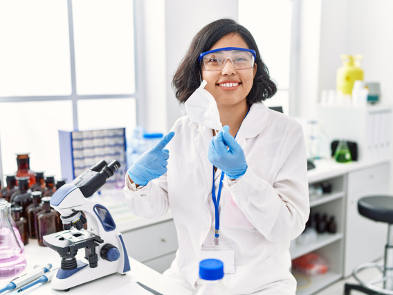 student happily working in a lab