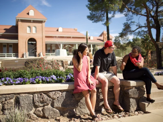 students outside of old main
