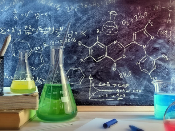 chemistry in front of black board